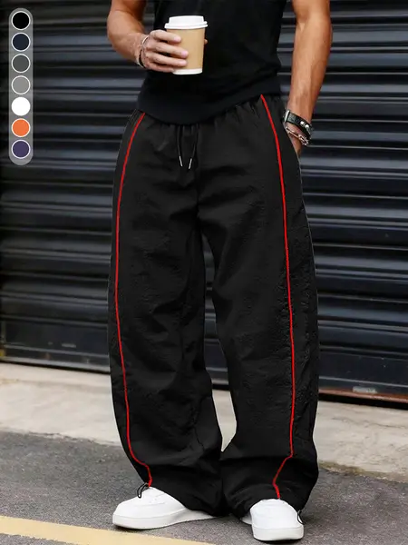 Men’s summer black-and-red quick-dry wide-leg pants with side stripes and a drawstring waist; breathable fabric with a slight wrinkle texture, loose straight cut, side stripe detailing, adjustable cuffs at the leg openings. Suitable for jogging, fitness,