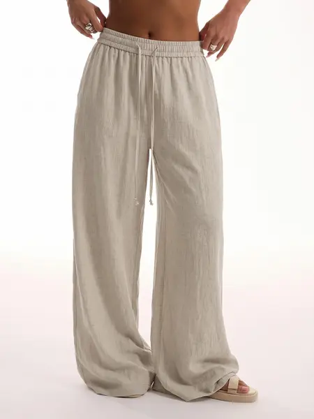 Women’s ultra-comfortable pants made from Lyocell linen weave, featuring a drawstring elastic waistband, lightweight drapey fabric, and wide legs—suitable for sports and everyday casual wear, versatile for two ways of wearing.