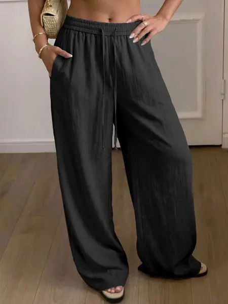 Women’s ultra-comfortable casual pants made from Lyocell linen weave, featuring pockets, a drawstring elastic waistband, soft fabric, and drapey legs—an essential for summer.