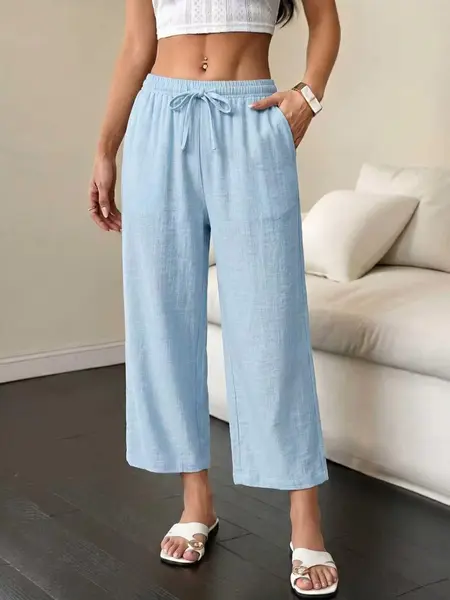 Women’s lightweight 9/10 pants—comfortable for home wear with a drapey feel, elastic waistband with drawstring and side pockets; versatile casual style that works for beach and vacation outfits—an essential piece for summer.