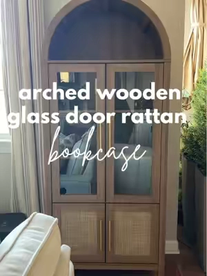 This arched bookcase slid right on to one of my FAVORITE purchases ever on TikTok shop! My goodness is it GORGEOUS! Soft close doors, adjustable hinges, shelves and the glass makes it pure perfection! Linked below! #bookshelf #bookcase #archedbookcase #arched #archedbookshelf #furniture #glassdoors #glassdoor #rattan #rattanfurniture #wood #woodenbookshelf #woodenbookcase #modern #modernhome #modernhomedecor #aesthetic #aesthetics #farmhouse #farmhouseliving #farmhousedecor #shelf #shelving #springglowup #tiktokshopspringsale #tiktokshopspringsale2025 #livingroomdecor #livingroominspo #books #tiktokfurniture 