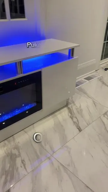 This 70” Fireplace TV Stand from Pukami is so nice! I love it’s sleek modern design. It holds up to 80” TVs and does 20 Different Colors. It has 12 Different Flame colors and has 1-8 Hour Timer Settings. It also puts out 750w-1500w of heat.Click on the cart to check it out! @PUKAMI #fireplace #decor #homedecor #furniture #tvstand #fyp #musthaves
