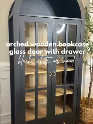 One of your FAVORITE purchases ever will be this bookcase! Stunning glass doors, drawer on the bottom and that arch is EVERYTHING! Linked below! Comes in black or white! #bookshelf #bookcase #archedbookcase #arched #archedbookshelf #furniture #glassdoors #glassdoor #wood #woodenbookshelf #woodenbookcase #modern #modernhome #modernhomedecor #aesthetic #aesthetics #farmhouse #farmhouseliving #farmhousedecor #shelf #shelving #springglowup #tiktokshopspringsale #tiktokshopspringsale2025 #livingroomdecor #livingroominspo #nook #book #books #BookTok #tiktokfurniture 