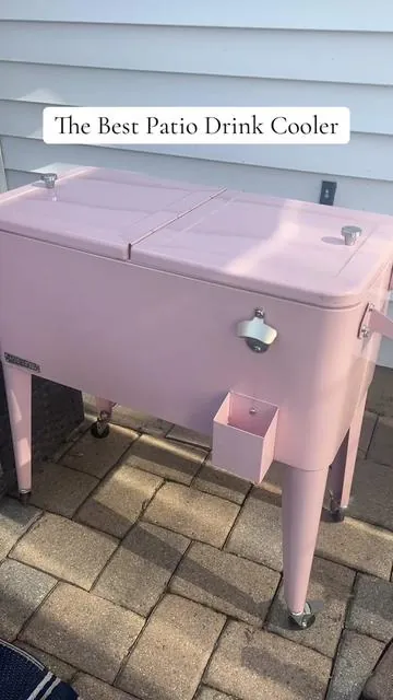 I LOvE my pink beverage cooler! It gives our patio just a hint of girl!  . . . . . . . . . . . . . #patio #patiomakeover #patiodecor #beveragecooler #cooler #summerfun 