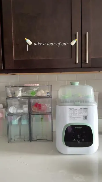 absolutelyyy if you’re a new or expecting mom you need this setup. our acrylic drawers keep all the bottle + pump parts organized and dust-free, and the momcozy washer? it cleans, sterilizes and dries. no more scrubbing at the sink while half asleep 🙃 plus it comes with free gifts right now so like… run. #stackablestorage #stackabledrawers #babybottlestation #babybottleorganizer #momcozy #momcozybottlewasher #kleanpro  Stackable acrylic drawers  Baby bottle station Baby bottle organization  Momcozy Momcozy baby bottle station 