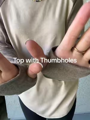 This long top is cozy, the fabric drapes nicely and it comes in so many pretty colors.  #wiholl #tunictop #longtops #shirtswiththumbholes #fallfashion #cozytops 