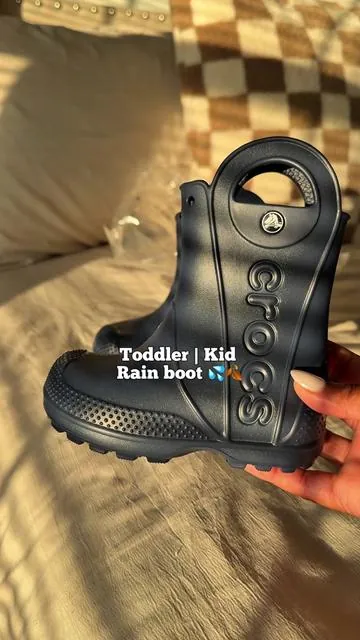 Perfect for puddle jumping this fall 🍂👢 These Crocs Toddler Kid Rain Boots are lightweight, waterproof, and have easy-to-grab handles so your little one can put them on all by themselves. Available in so many cute colors—your toddler will love them as much as you do! #CrocsRainBoots #ToddlerFallFashion #ToddlerRainBoots #FallWithKids #ToddlerStyle @Crocs 