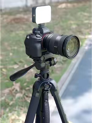 This compact tripod is packed full of cool features, A universal tripod for both cameras and phones--perfect for creators. #videography #tripod #phonestand #photography #videography 