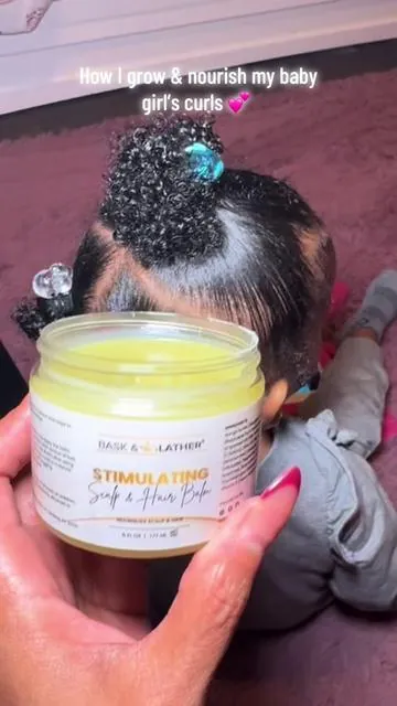 This Black-owned @Bask and Lather Co stimulating hair balm has my baby girl’s curls thriving 👶🏽✨ soft, nourished, and safe for her little scalp 💕 #babyhairgrowth  #blackowned  #naturalhair  #healthycurls  #safeforkids 