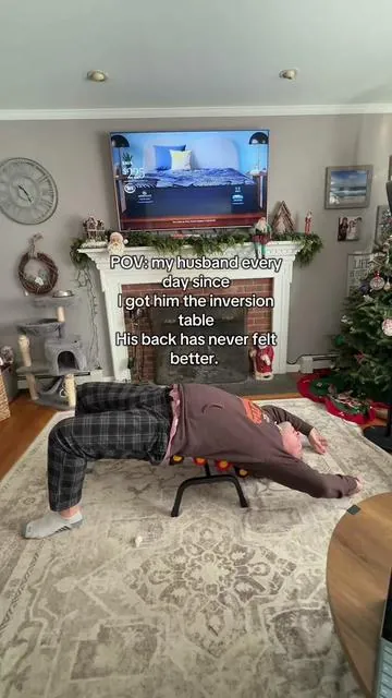 He had wanted an inversion table for ever but we didn't have room. This one is stretching his back and fits in our living room! He said his back had never felt better! #newyearnewme #backpain #inversion 