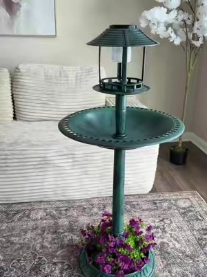 STUNNING and it gives a beautiful glow at night #solarlight #birdbath #planter #gardendecor #homedecor 