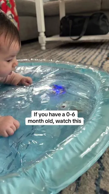 Tummy time was lasting 30 seconds in our house 😅 If your baby hates tummy time, this light up tummy time water mat makes it so much easier. The floating pieces and lights actually keep them engaged so they practice lifting their head longer. Tummy time is so important for neck strength and early development but it doesn’t have to be a battle. #tummytime #tummytimemat #babymusthaves #0to6months #newbornactivities   