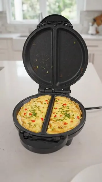 Breakfast goals unlocked! 🍳✨ Make two perfect omelets or delicious frittatas at once with the Elite Gourmet Dual Maker. Super easy for busy mornings or brunch with friends. Get creative with your fillings and enjoy restaurant-quality meals right from your kitchen! Shop now and elevate your breakfast game. #OmeletMaker #FrittataMaker #BreakfastIdeas #EasyRecipes #TikTokMadeMeBuyIt #Moras