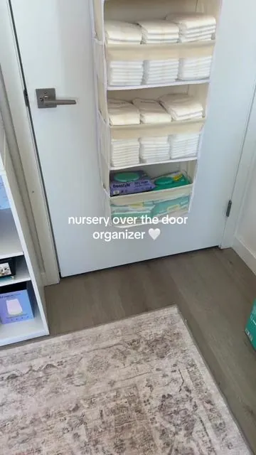 this over the door organizer is perfect for small nurseries with limited storage #diaperbagessentials #nurseryorganization #homehacksessentials #overthedoororganizer #storagecabinets 