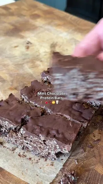 Mint Chocolate Protein Cereal Bars 🍫 Recipe below 👇 Each bar has 10g protein thanks to @ShopFlavCity Mint Chocolate Protein! Grab it on TT shop and give these a try!  Ingredients: 1 cup dark chocolate chips  1 tablespoons coconut oil 1 scoop FlavCity Mint Chocolate Protein Smoothie Powder  2 cups chocolate cereal crispies  Directions:   1  In a double boiler add the chocolate chips and stir occasionally until they’re melted and smooth. Add the coconut oil and stir until it’s melted and combined well. Remove from heat then stir in the FlavCity Mint Chocolate Protein Smoothie powder.    2  To a separate bowl add the cereal, then pour the melted chocolate over top, reserving about ¼ cup. Gently mix the cereal with the chocolate, then transfer to a parchment paper-lined container (6x4) and lightly press to set.    3  Take the remaining melted chocolate and drizzle it over the top. Cover and refrigerate until set, 30 minutes to 1 hour. Remove from the fridge, and using the parchment paper take it out of the container, then cut into 4 bars. Enjoy immediately or store in an airtight container in the fridge for up to 5 days. #tiktokshopcreatorpicks #proteinbar #mintchocolate #proteinbarsnack #healthysnacks 