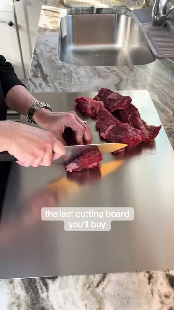 Upgrade your kitchen with a stainless steel cutting board that won’t trap stains, odors, or bacteria like plastic or wood. This non-porous metal board lets you prep meat, fruit, and veggies with just a quick wipe or rinse in between. No microplastics, no residue, no cross-contamination worries. Durable, hygienic, and built to last. #KitchenEssentials #StainlessSteel #HealthyHome #CookingHacks #CuttingBoard 