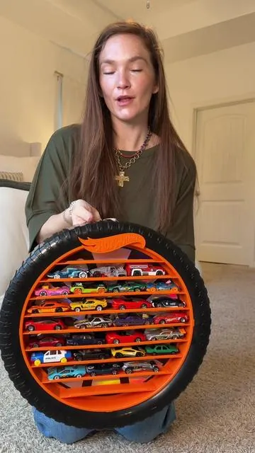 Finally a display that shows off the collection instead of hiding it 🙌🔥 This tire-inspired case keeps their favorite cars organized, protected, and actually looks cool on the wall. No more bins. No more mess. Just a setup they’ll be proud of. Perfect for little collectors (and grown-up ones too 😉). @QVC, Inc #cardisplay #toycar #toycars #toyorganization #kidsroom 