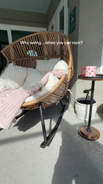 If you love the look of hanging egg chairs but want something more stable, this rocking version is such a cozy upgrade for a patio. #eggchair #cozyvibes #cozychair #rockingchair 
