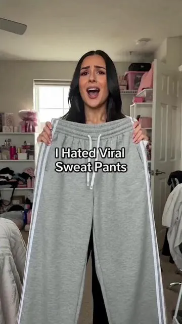 Y'all, look! Check out these **cute sweatpants** I got from TikTok Shop! I have to show you. Don't mind my shorts underneath, but look! They're so **cute**, and you **get two pairs**. I'm obsessed! Click the link below. #twopieceactivewear #sportspants #tracksuits #highwaistsportsshorts #workoutpant #juicycouturetracksuit #stripedjoggers #aritziasweatsuit #womenwidelegpants #sportsleggings
