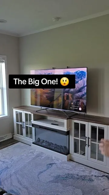 98-inch farmhouse TV stand with built-in electric fireplace combines entertainment, storage, and cozy ambiance in one statement piece. Large design fits TVs up to 100 inches while glass cabinets, adjustable shelves, and spacious storage help keep your living room organized and stylish. #TVStand #ElectricFireplace #FarmhouseDecor #LivingRoomFurniture #entertainmentcenter 