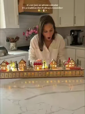 This wooden advent calendar isn't just decor—it sings and turns every December day into a little family tradition. A cozy Christmas village keepsake you'll bring out year after year✨ #adventcalendar #christmastraditions #holidaymagic #christmas #christmasinjuly