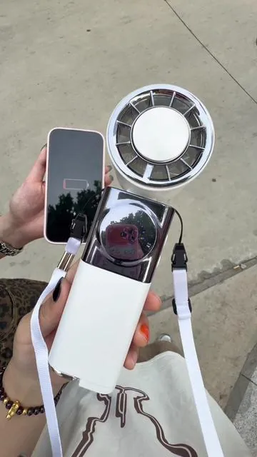 Who else hates being hot and dead phone batteries this fan is a game changer🤯 #CoolingGadget #PowerBankCombo #SummerMustHave #dealsforyoudays 