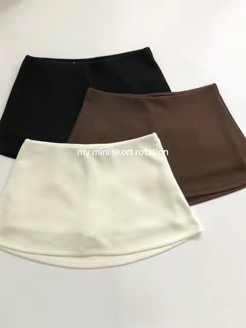 Black, white, and brown = the little skort rotation I'd actually wear on repeat. Mini skirt look, built-in shorts, and so easy to style. #skort #skorts #miniskort #skortoutfit #builtinshorts