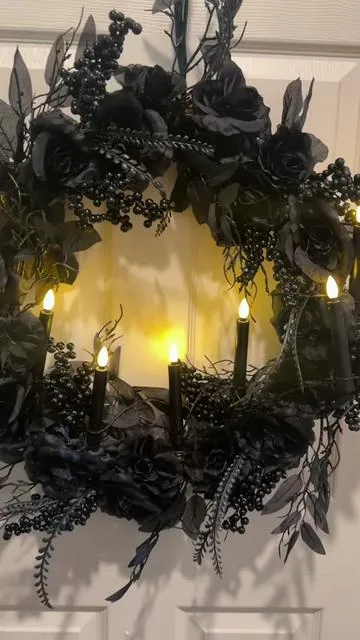 Mr Halloween wreath is hauntingly beautiful! The black roses, berries, and elegant leaves give it the perfect gothic look, and the flickering candles add the coziest eerie glow. If you're decorating for Halloween or love dark, dramatic décor, grab this before it's gone @QVC, Inc #halloweendecor #spookydecor #gothicstyle #countdowntohalloween  