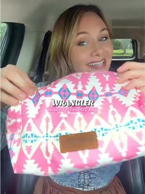 🤠🩷🌵 I fall more in love with this little pink bag every time I reach for it!  @Rustic Charm Bootic #wrangler #makeupbag #toiletrybag #traveltok #westernaesthetic 