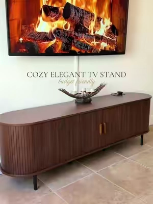 Cozy meets elegant 🤎 This fluted TV stand with sliding doors adds the perfect mix of warmth, texture, and modern style to any living room. I’m obsessed with how elevated it makes the whole space look! #TVStand #LivingRoomFurniture #LivingRoomDecor #HomeDecor #HomeFinds  