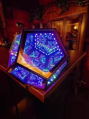 This dodecahedron, featuring infinite mirrors, makes for an incredible decorative piece.  #Dodecahedron #InfiniteMirrors #DecorativePiece #HomeDecor #fyp