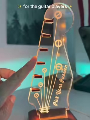 This guitar pick holder stand lights up and is the perfect gift idea for musicians or guitar players.