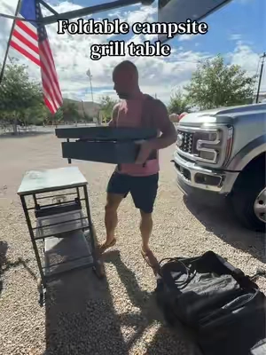 The perfect camping grill table does exist!  This one folds completely flat to fit in our RVs pass thru storage, sets up in seconds and can take the heat and weight of our Blackstone, smoker and charcoal grill!  #rvlife #camperlife #campingseason #rvaccessories #cookingoutdoors 