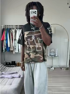 (Low Stock) #aelfriceden #jersey #streetwearfashion #graphictees #oversizedhoodie  The Aelfric Eden 77 Camouflage Football Jersey blends vintage sportswear with modern streetwear. Featuring an oversized football jersey fit, all-over camouflage print, and bold 77 varsity graphic, it’s an easy statement piece that pairs perfectly with baggy jeans, cargos, jorts, or sweatpants. Whether you’re into Y2K fashion, football jerseys, camo streetwear, or oversized fits, this jersey brings effortless style while staying comfortable for everyday wear. Grab your size while it’s still available. 🛒⬆️ (Aelfric Eden, Aelfric Eden Football Jersey, Aelfric Eden Camo Jersey, Camouflage Football Jersey, Camo Jersey, Football Jersey, Oversized Jersey, Oversized Football Jersey, Streetwear Jersey, Y2K Jersey, Vintage Football Jersey, Men’s Streetwear, Y2K Fashion, Camo Streetwear, Baggy Streetwear, Graphic Jersey, Varsity Jersey, Men’s Fashion, Outfit Inspiration, OOTD, Streetwear Style, Casual Wear, Everyday Essentials, TikTok Shop, Fashion Finds, Trendy Men’s Clothing, Oversized Fit, Summer Streetwear, Athletic Streetwear)