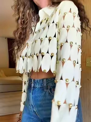 This top is wearable art. ✨ The oversized gold stud detailing gives it a designer look without the designer price tag. Pair it with denim for an elevated everyday outfit or wear it with the matching skirt for a statement moment that turns heads. #akira #statementtop #studdedtop #fashionfinds 