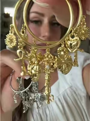 I simply cannotttt resist charm jewelry! So pretty and whimsical! ✨ @GANIA  #jewelry #earrings #charms #hoopearrings #hoops 
