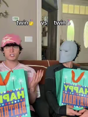 twins opening presents.