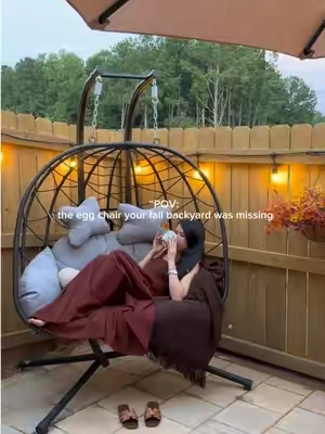 Cozy fall afternoons in my favorite egg chair 🍂🤎 The perfect little spot to enjoy the cooler days outside. ☕️ #EggChair #FallPatio #FallDecor #CozyBackyard #TikTokshopbacktoschool   