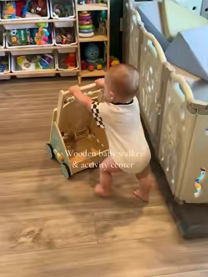 Not only does it help him with walking but he loves all the fun things on the front that he can play with!  #montessori #woodenbabywalker #babywalker #activitycenter 
