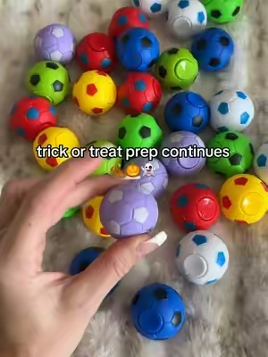 32 mini soccer ball fidget spinners to add to our Halloween trick or treat toy basket! #halloween #trickortreating #trickortreating #HalloweenTreats #classroomgifts 