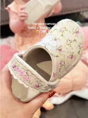 the NEW little canvas Crocs for toddlers and babies 🥹🌸 the prettiest florals and pinks + I loveeee this more durable canvas material for fall! #crocs #kidscrocs #babyshoes #girlmom #toddlershoes