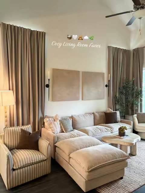 Our living room is full of TTS cozy favorites🧸🌿Tap the cart to see the details of our cozy modular + washable cloud sofa, brown wool blend rug, long blackout curtains, stone + cloud look coffee table, swivel boucle chair, and striped accent chair! #homefinds #cozyhome #organicmoderndecor #livingroomdecor #cozyathome  